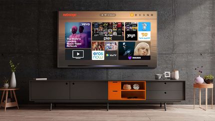 A TV in a living room showing the NetRange app portal
